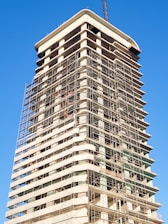 a tall building with scaffolding on the side of it
