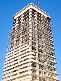 a tall building with scaffolding on the side of it