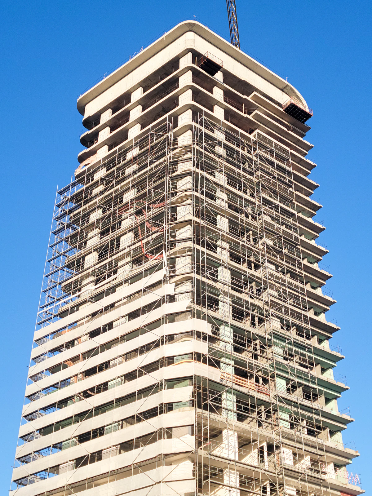 Tall building with scaffolding in Maputo, Mozambique