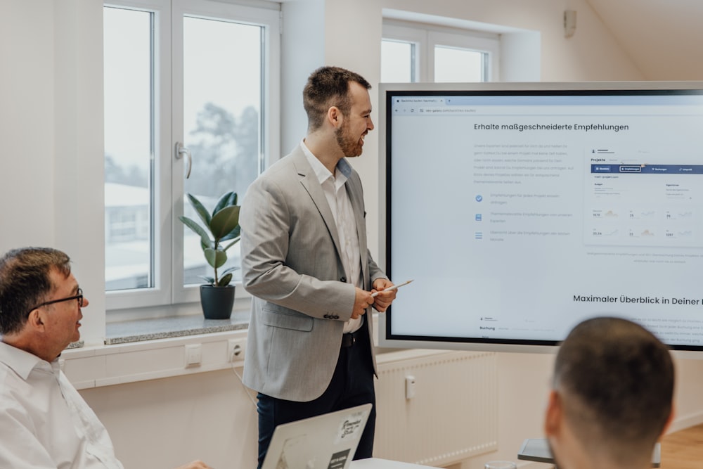 a man giving a presentation to a group of people