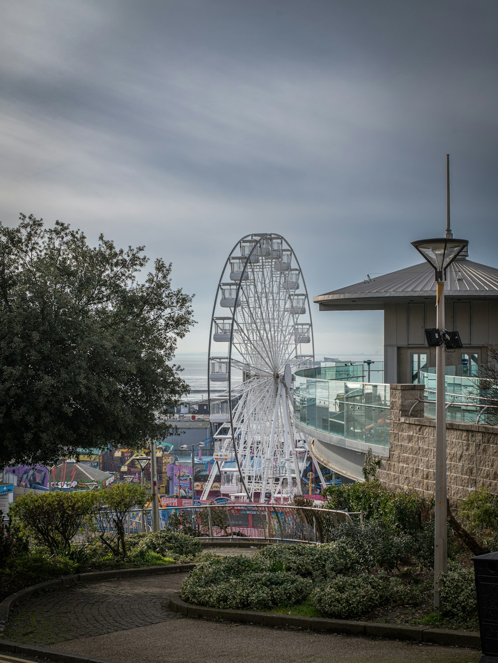 a large ferris wheel sitting next to a building