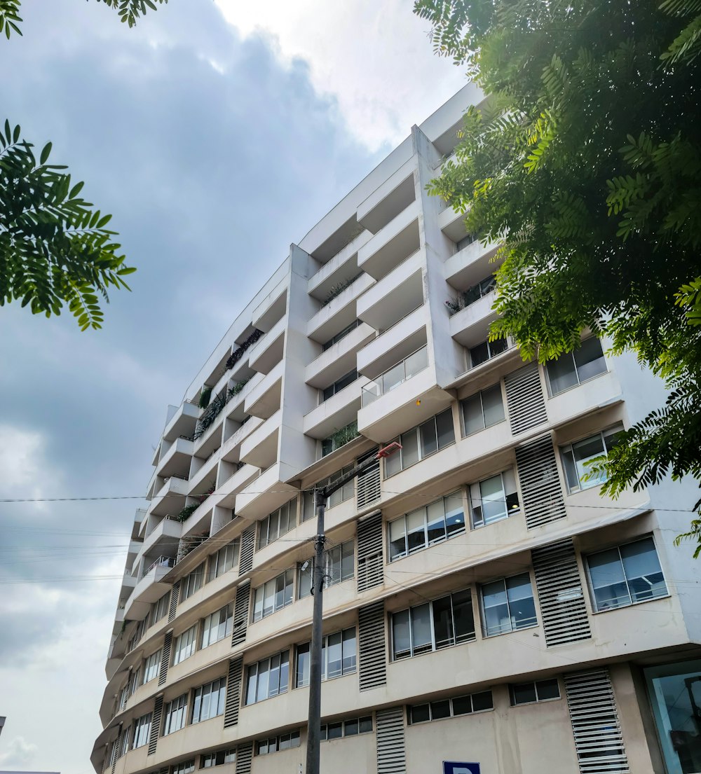 a tall building with balconies and balconies on the top of it