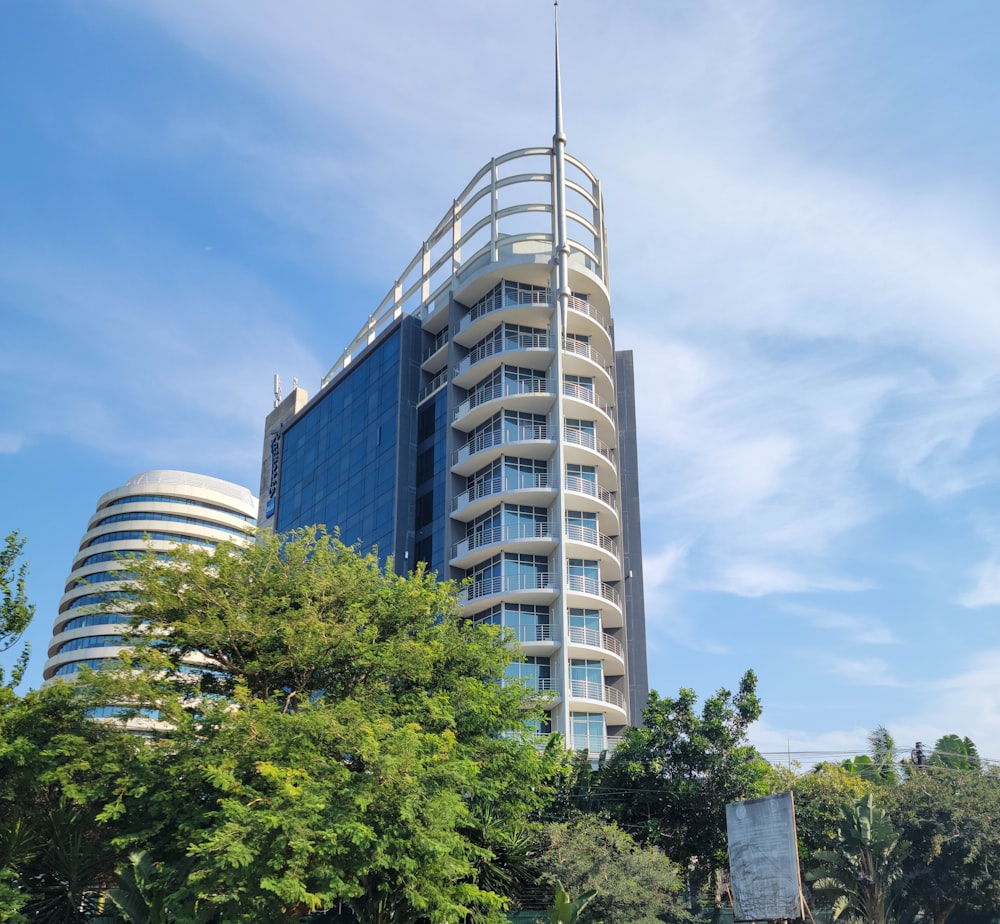 a very tall building with a flag on top of it