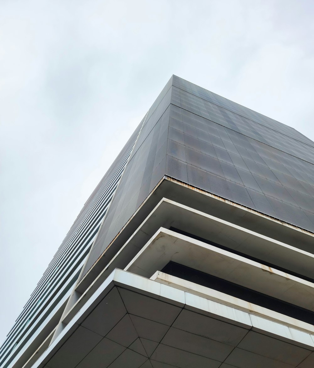 a clock on the side of a tall building