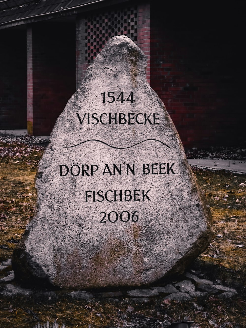 a large rock with a plaque on it