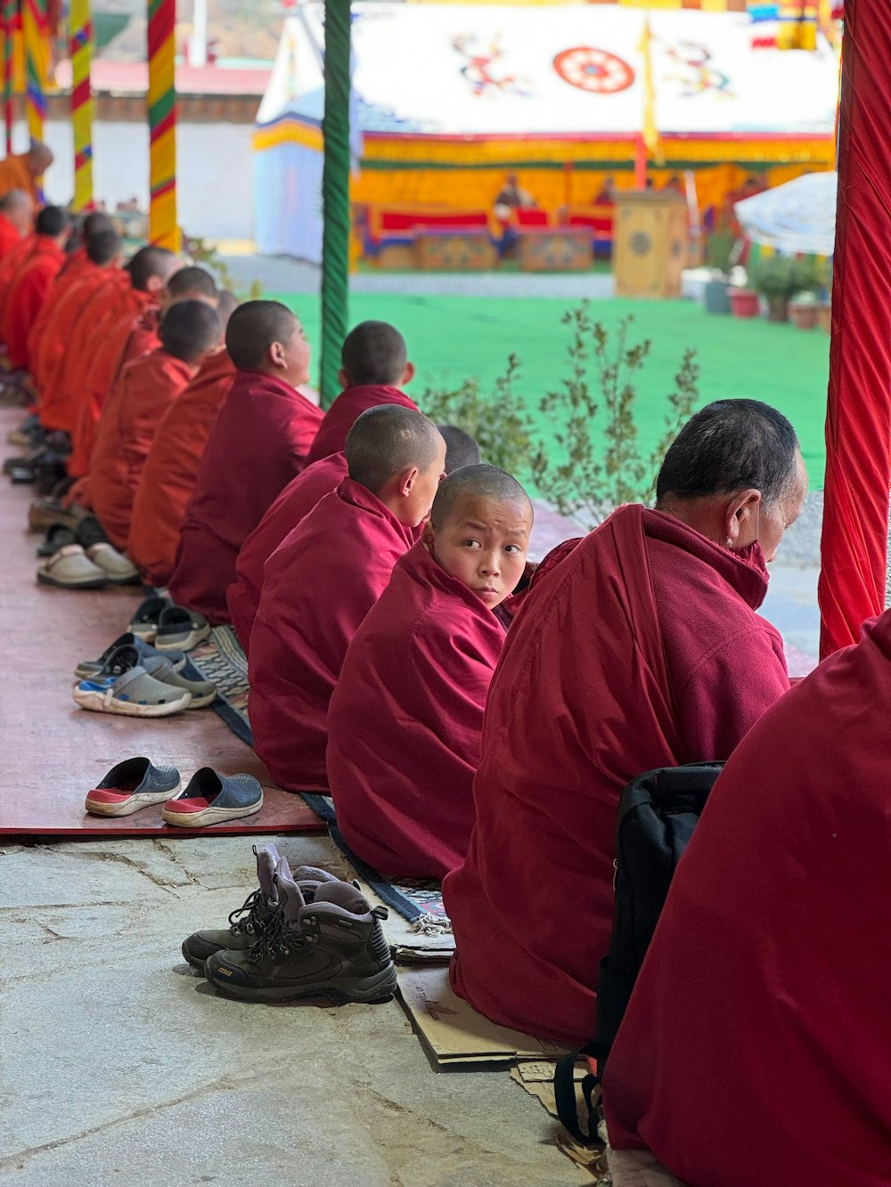a group of monks sitting in a row