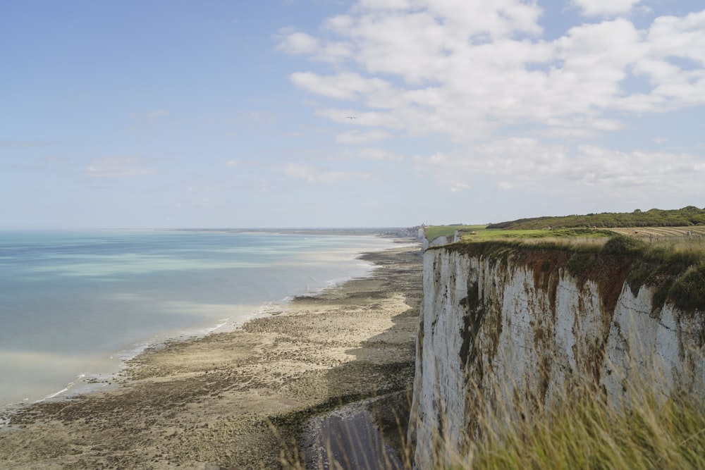 a view of a beach from a high cliff