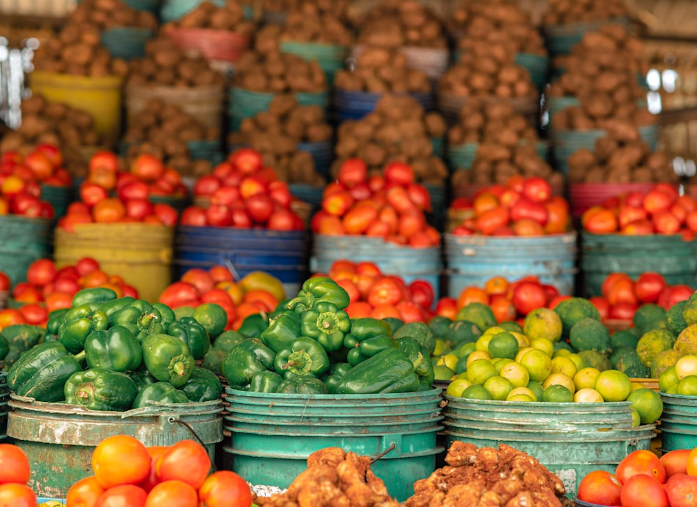 a bunch of baskets filled with lots of different types of fruits and vegetables