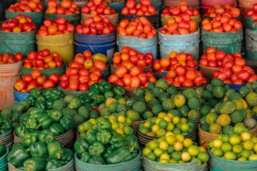 a bunch of baskets filled with lots of different fruits and vegetables