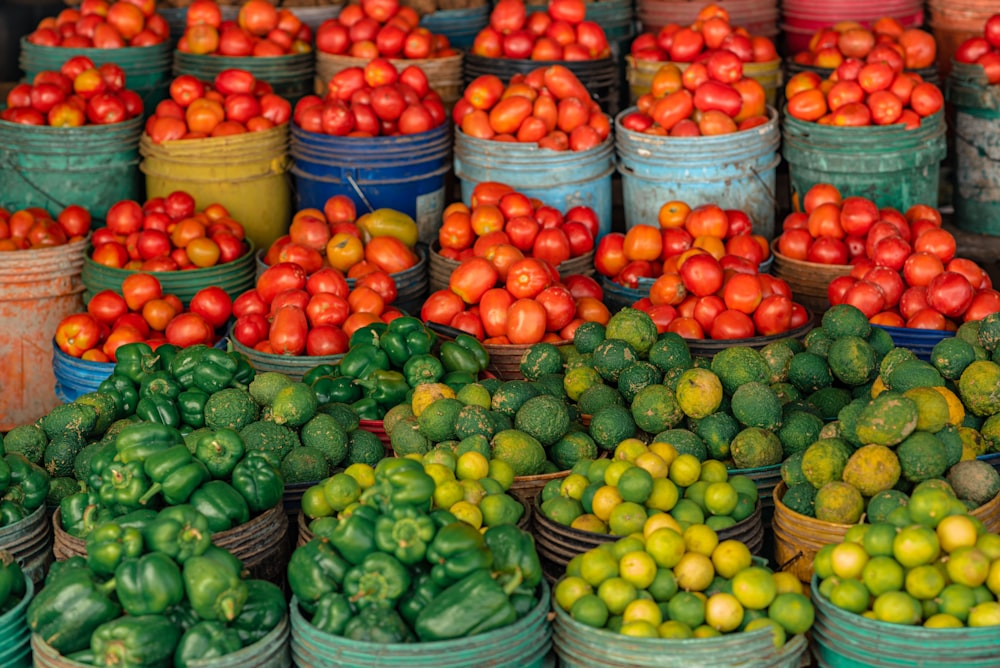 a bunch of baskets filled with lots of different fruits and vegetables