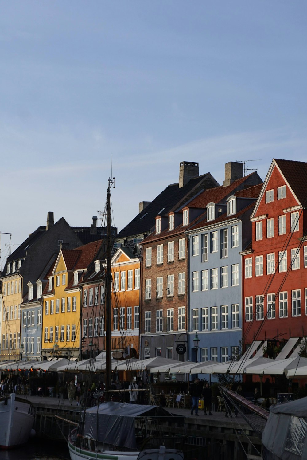 a row of buildings next to a body of water