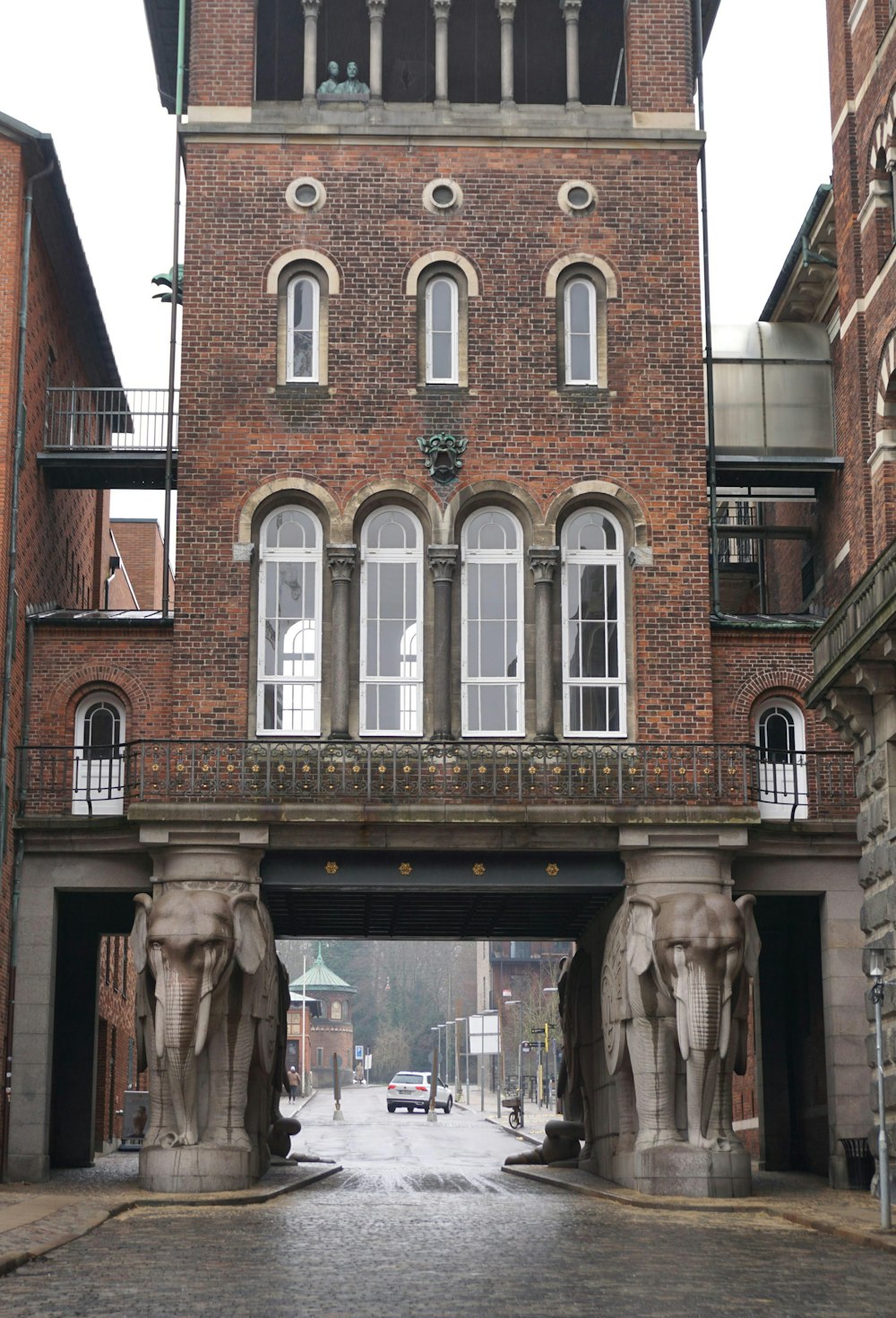 a tall brick building with a clock tower