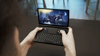 a person holding a tablet with a video game on the screen