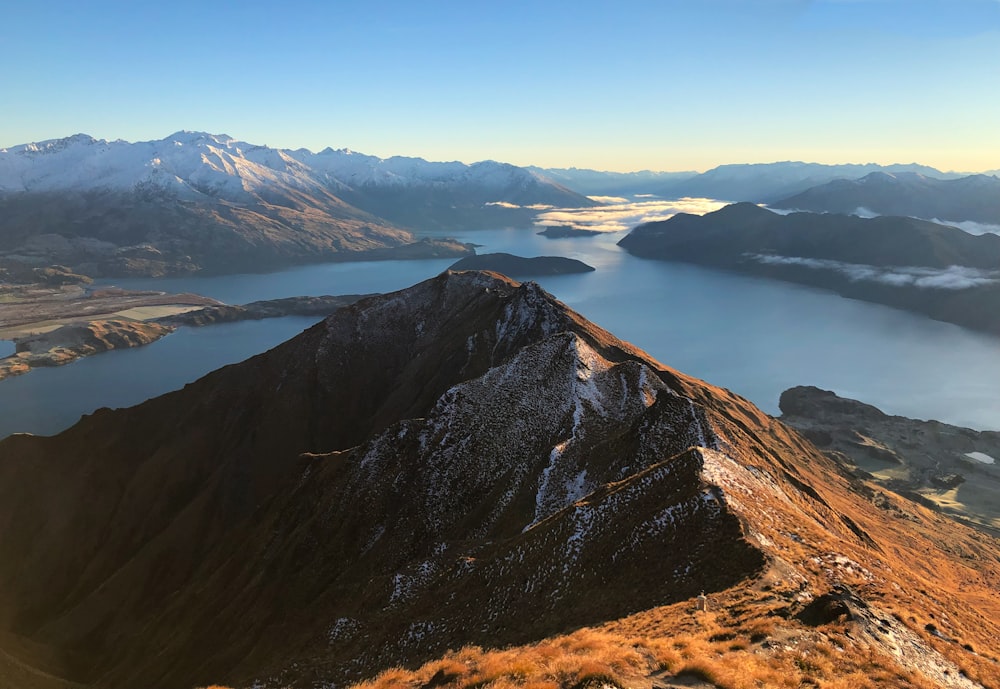 a view of a mountain with a lake in the middle