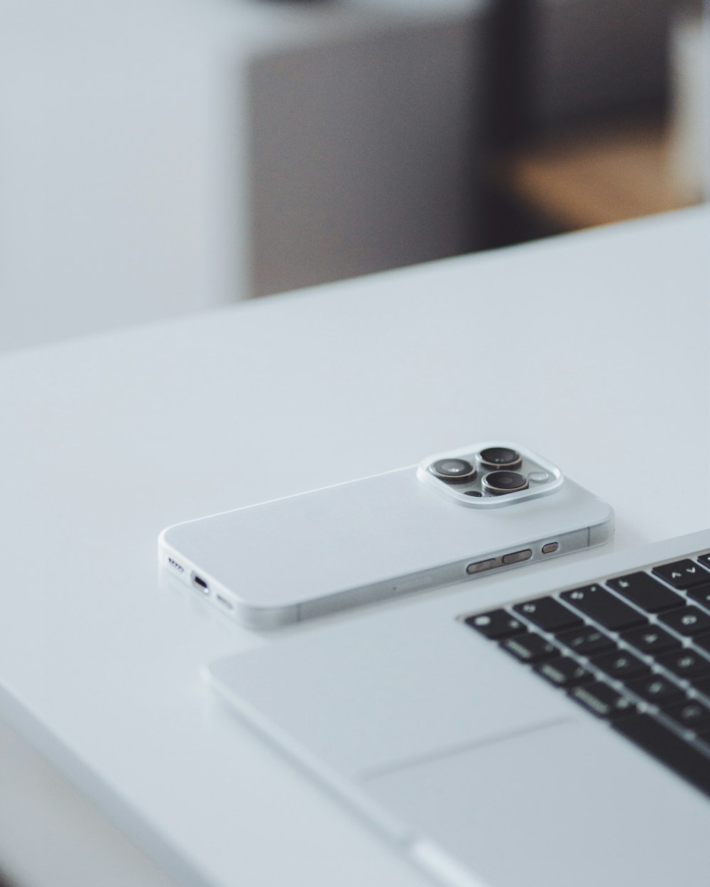 a laptop computer sitting on top of a white table