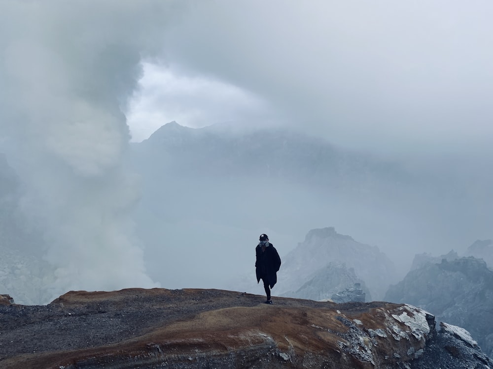 a person standing on top of a mountain