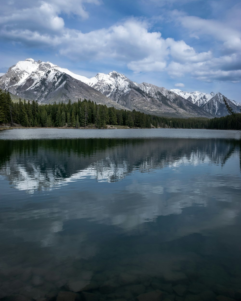 a large body of water with mountains in the background