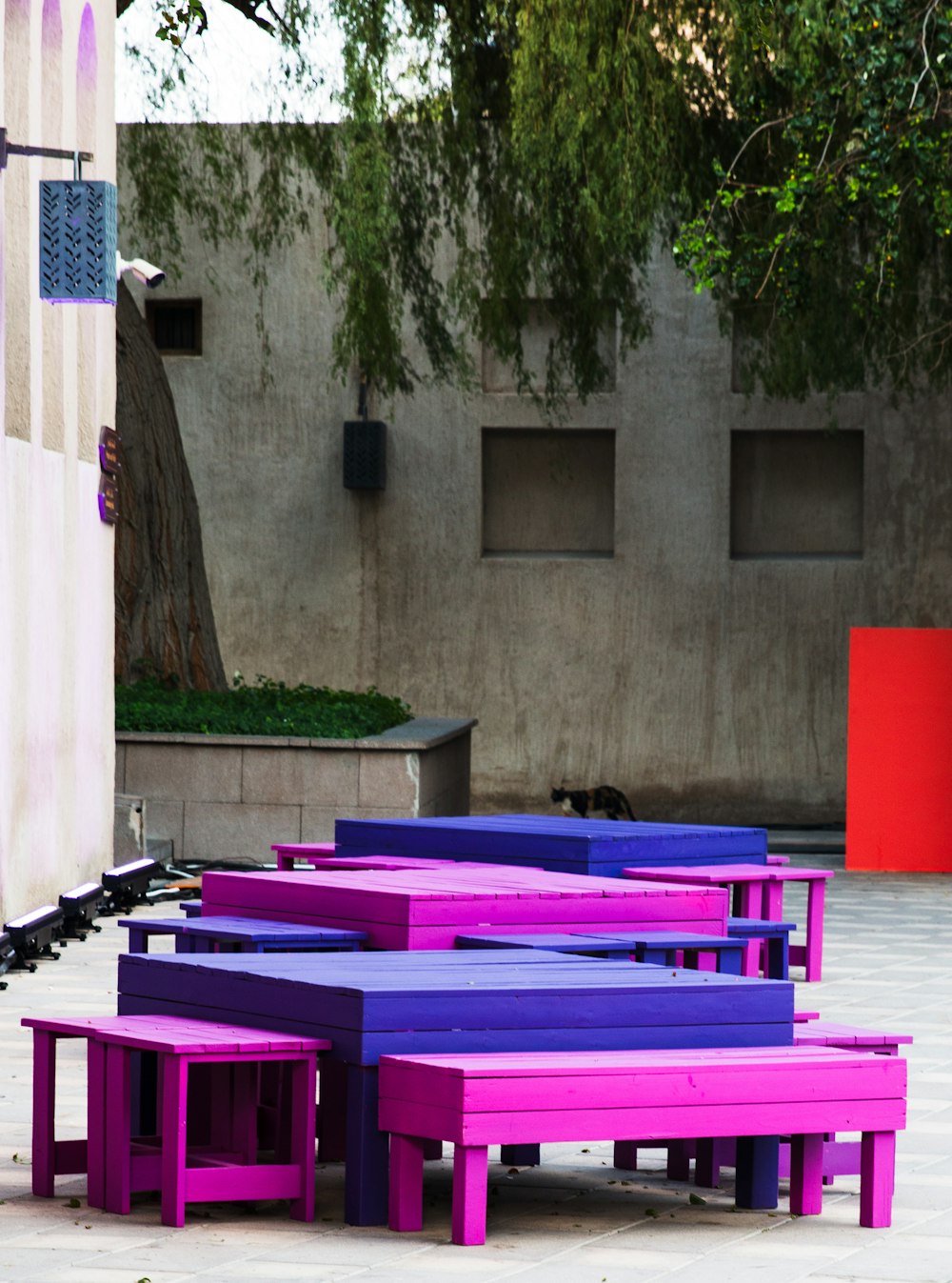 a group of purple benches sitting next to each other