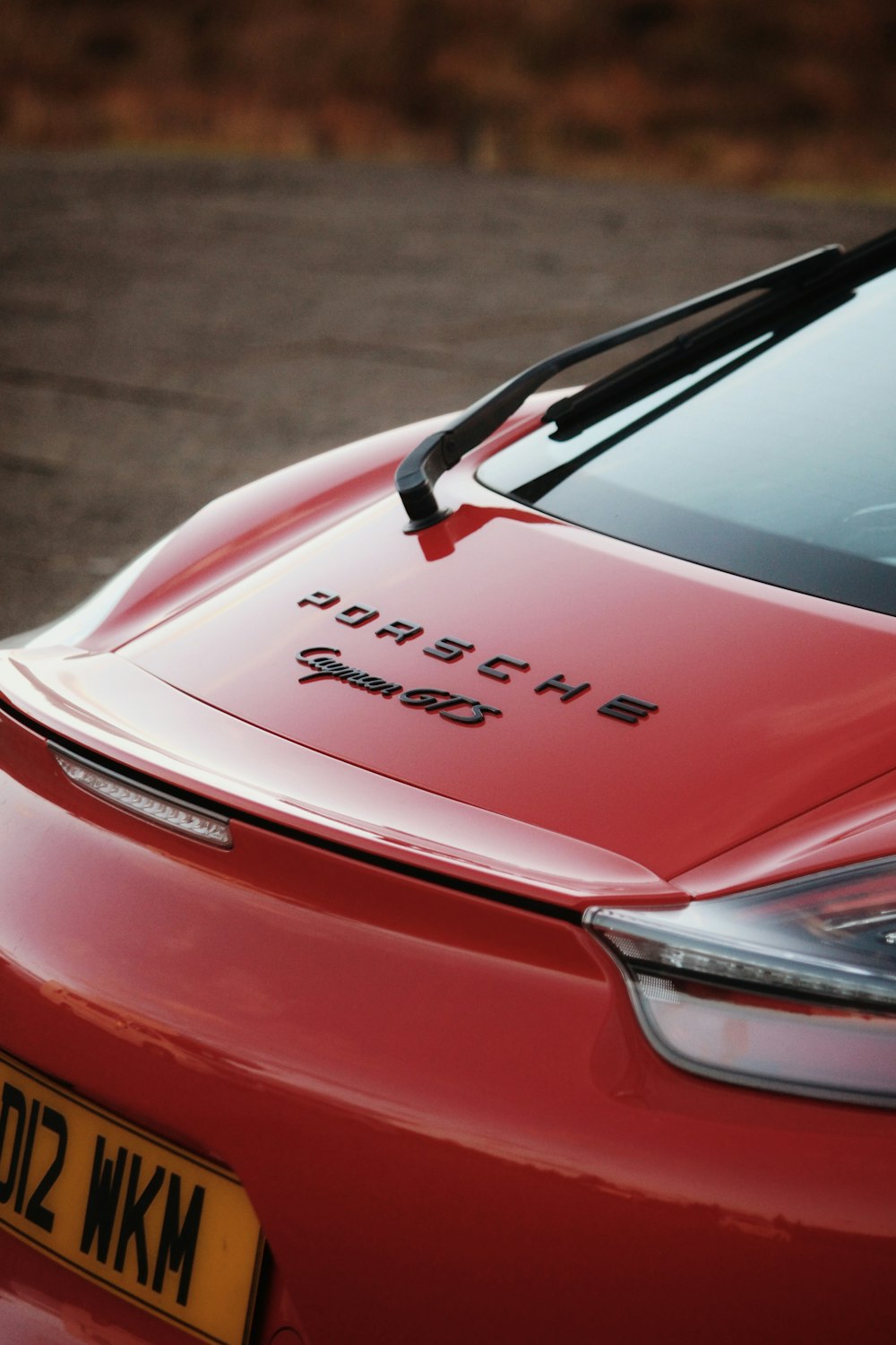 a red sports car parked in a parking lot