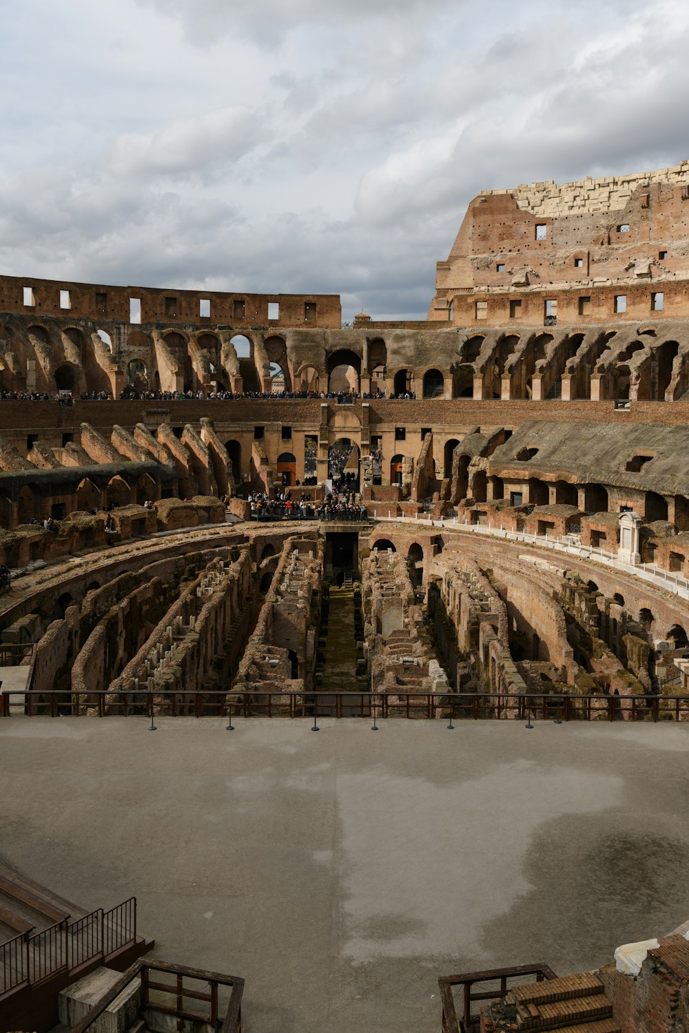 the interior of a roman colossion with a cloudy sky