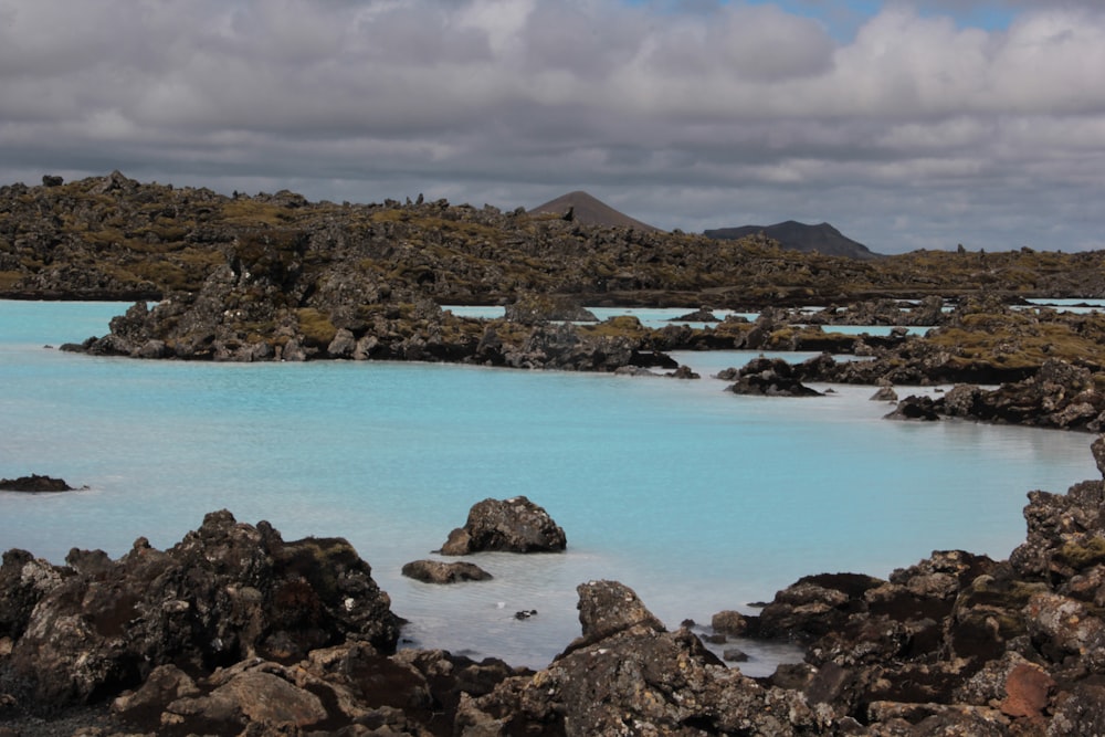 a large body of water surrounded by rocks