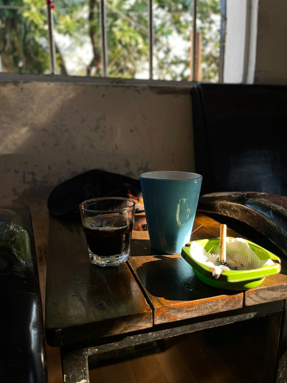 a table with a glass of water and a slice of lime on it