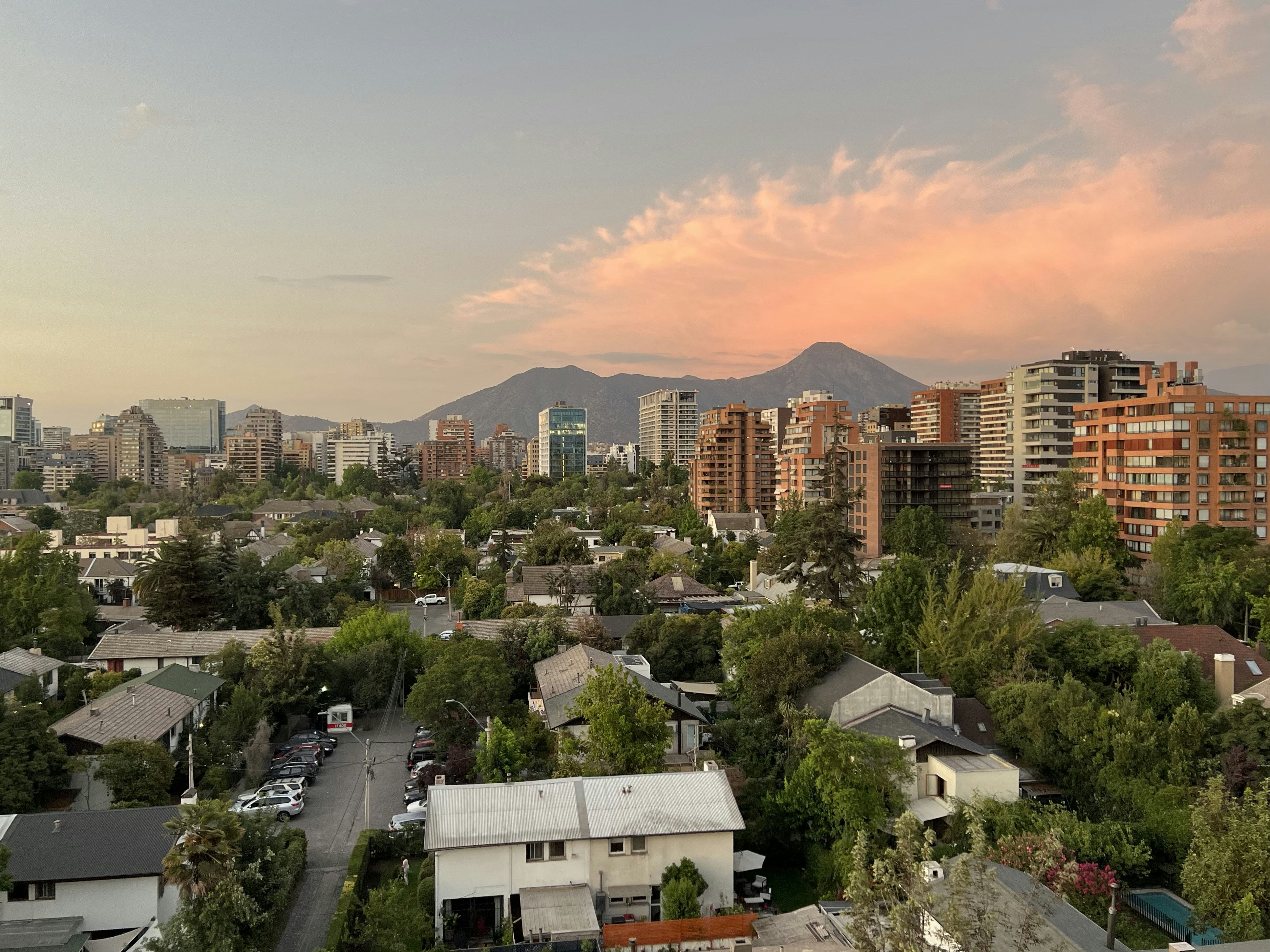 a view of a city with mountains in the background