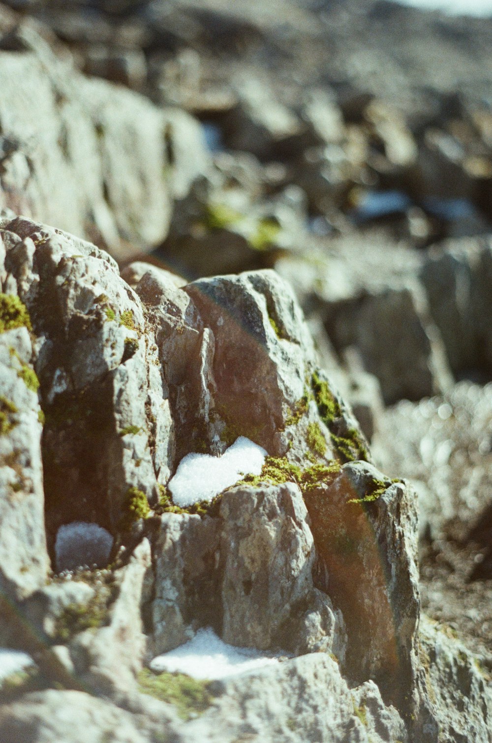 a rock formation with snow on top of it