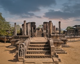 a large stone structure with a statue on top of it