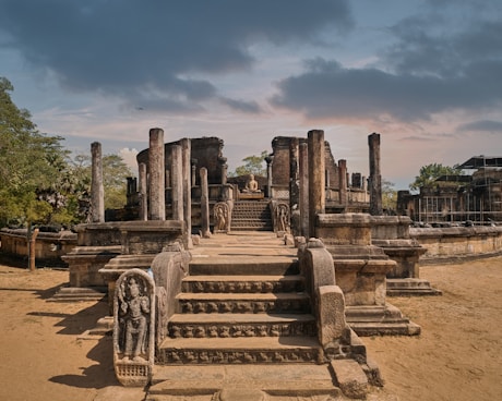 a large stone structure with a statue on top of it