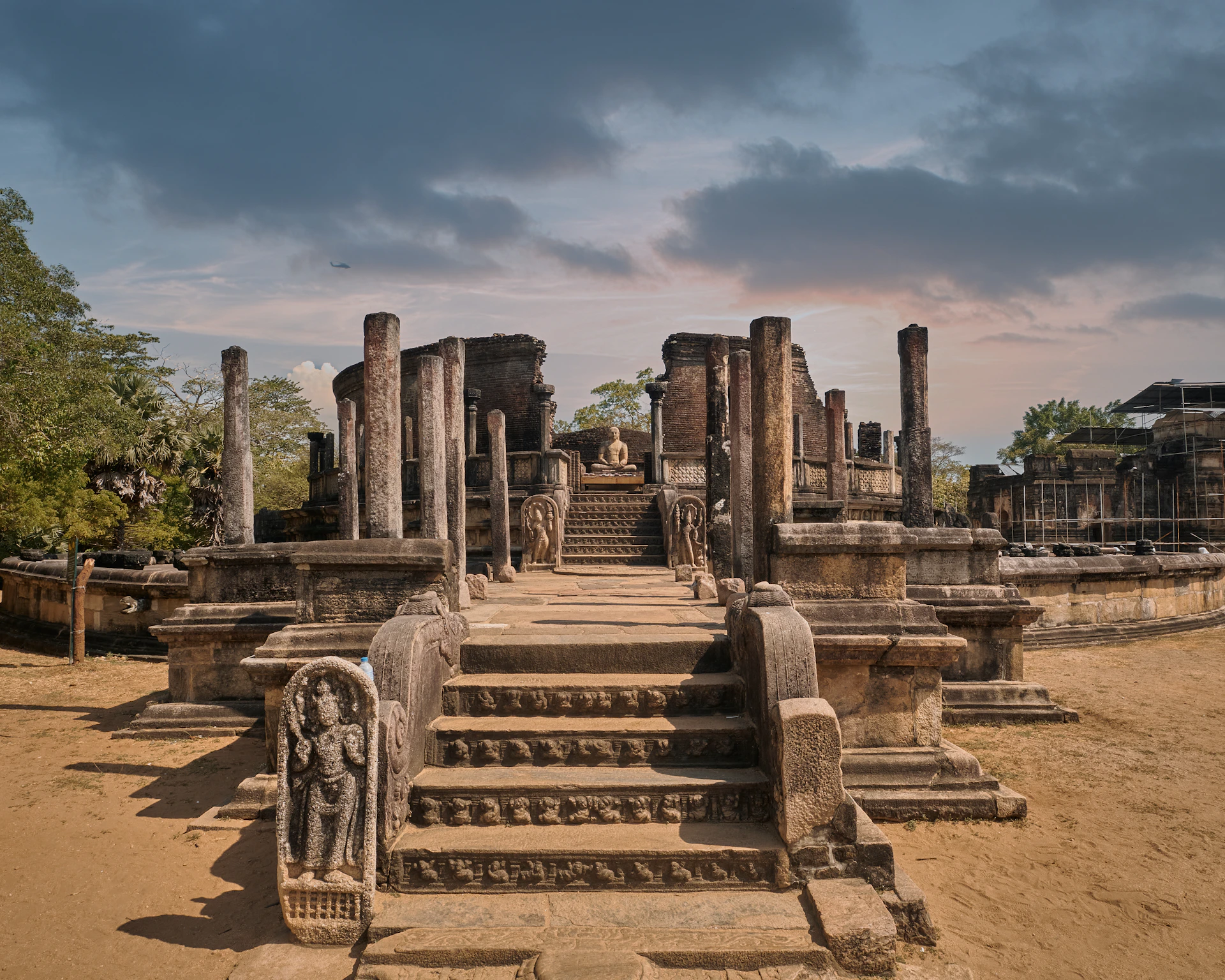 a large stone structure with a statue on top of it