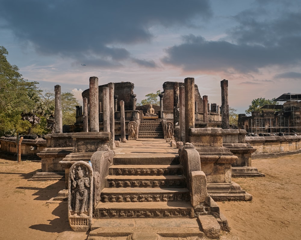 a large stone structure with a statue on top of it