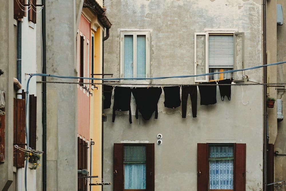 clothes hanging out to dry outside of a building