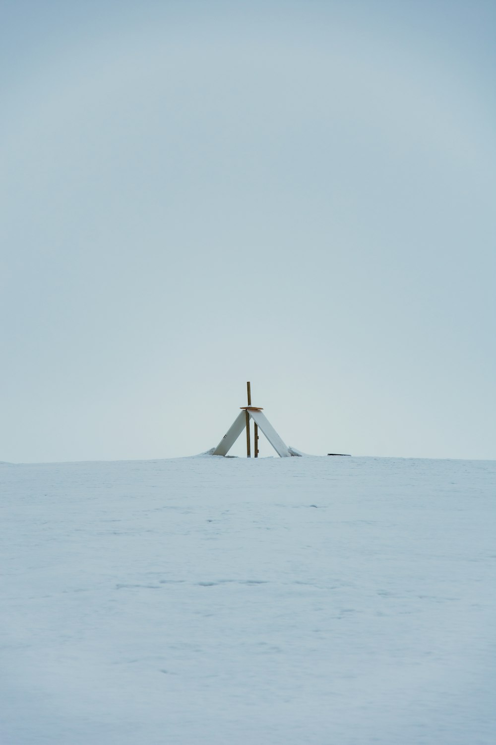 a cross in the middle of a large body of water