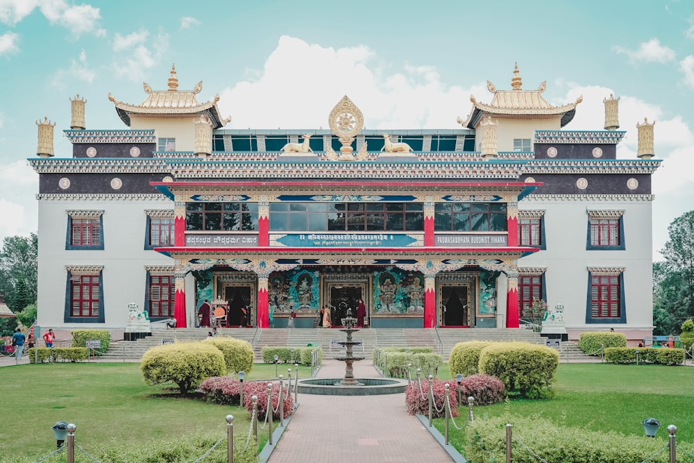 a large building with a fountain in front of it