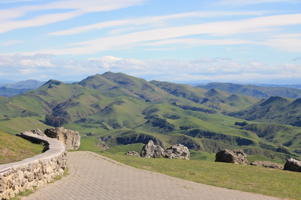 a scenic view of mountains and a road