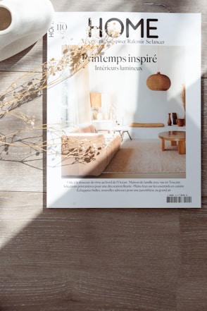 a magazine sitting on top of a wooden table
