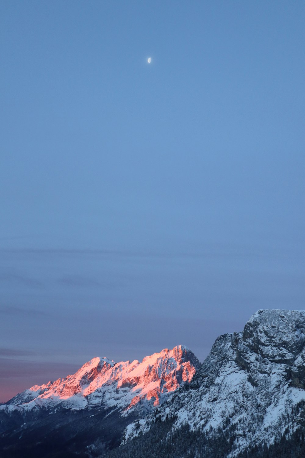 a person on a snowboard on top of a mountain