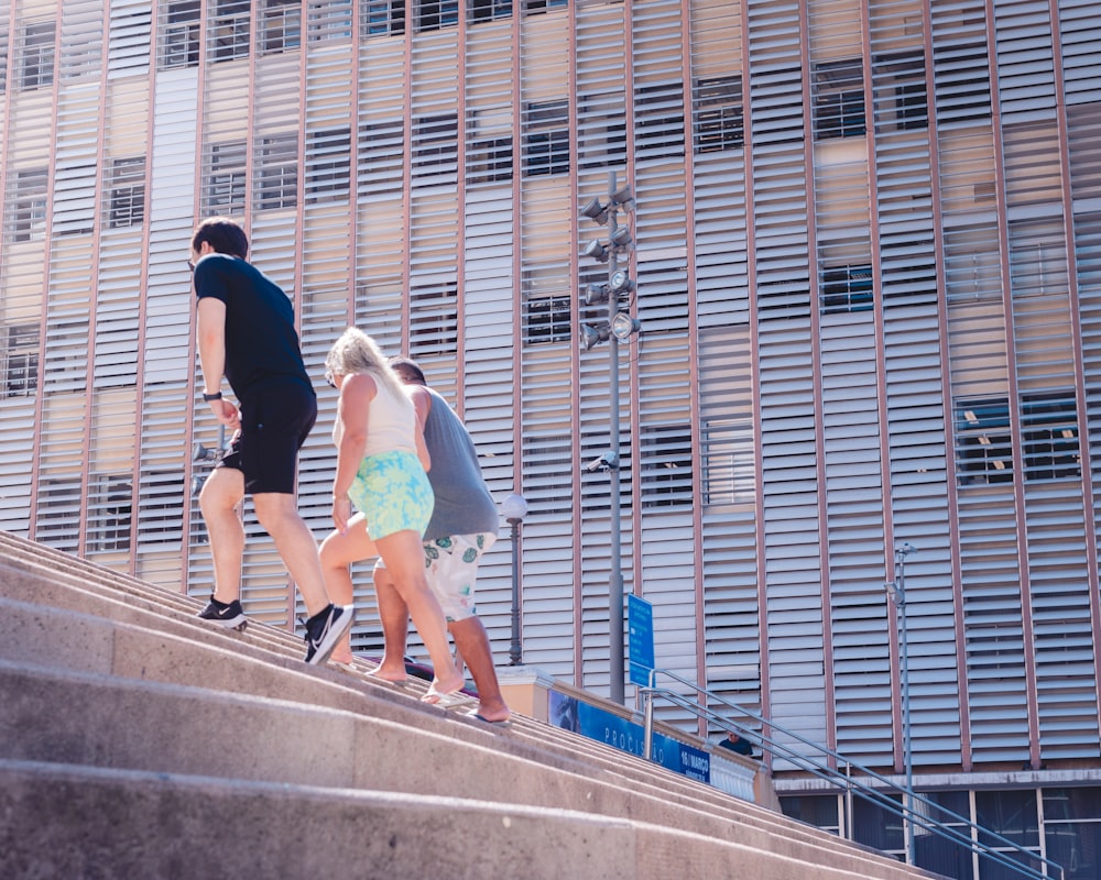 a couple of people that are walking up some stairs