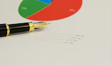 a pen sitting on top of a piece of paper