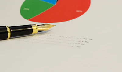 a pen sitting on top of a piece of paper