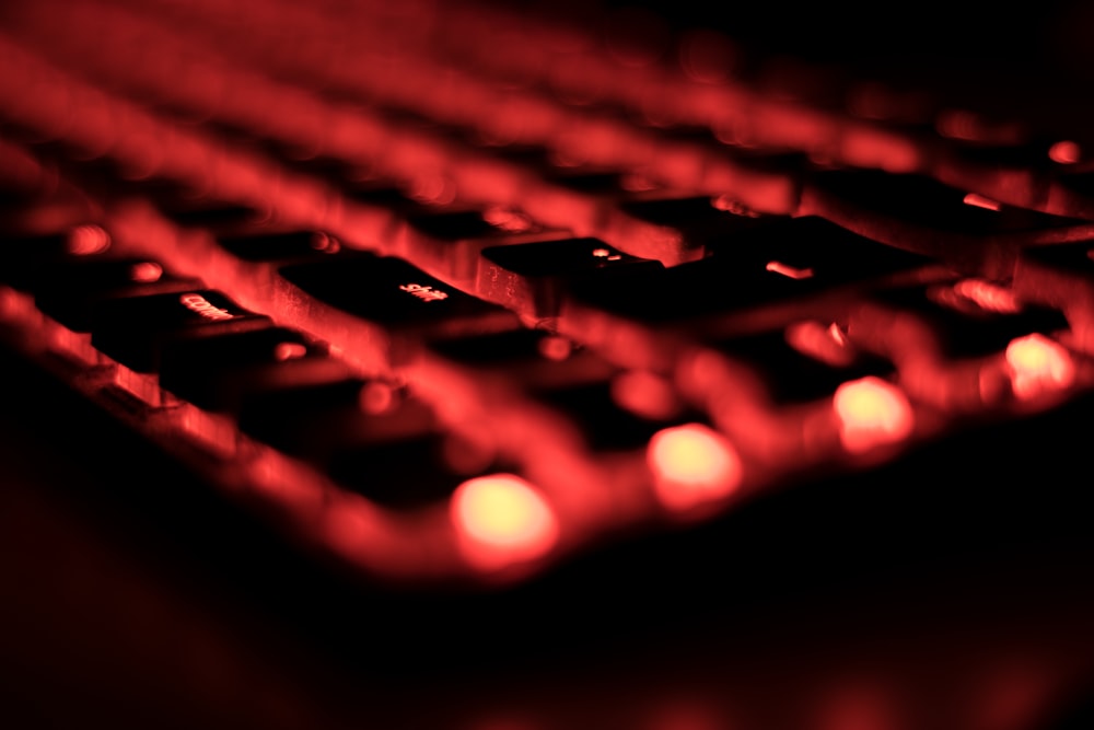 a close up of a red computer keyboard