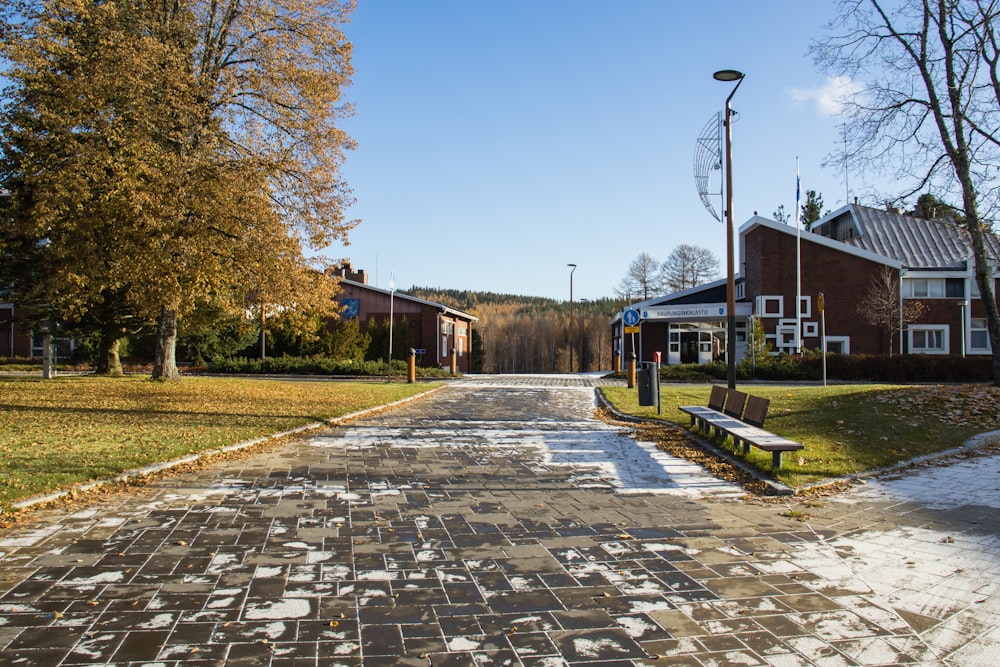 a park with a bench and some buildings