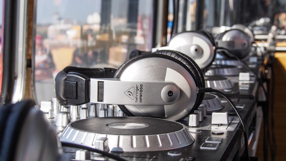 a row of headphones sitting on top of a table