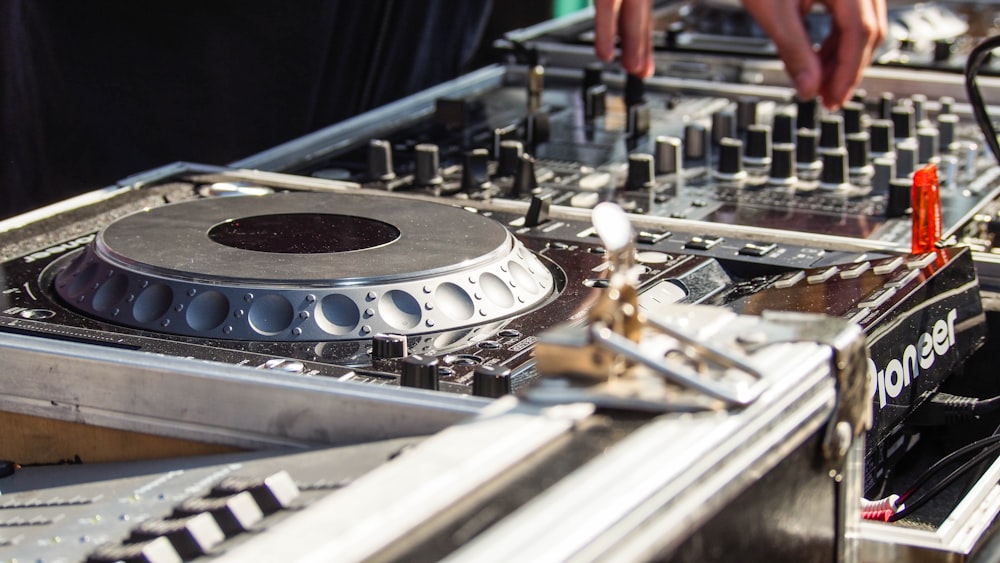 a close up of a dj mixing equipment