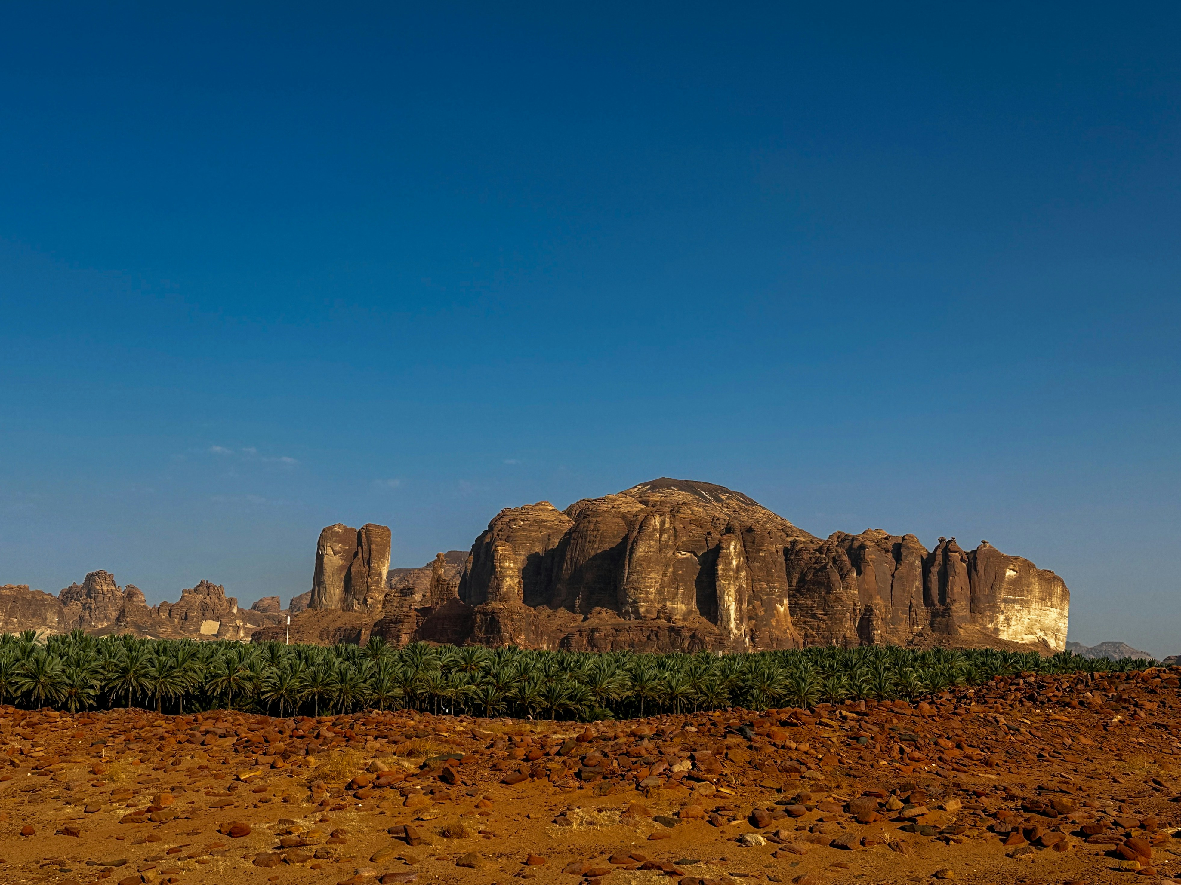 a large rock formation in the middle of a desert