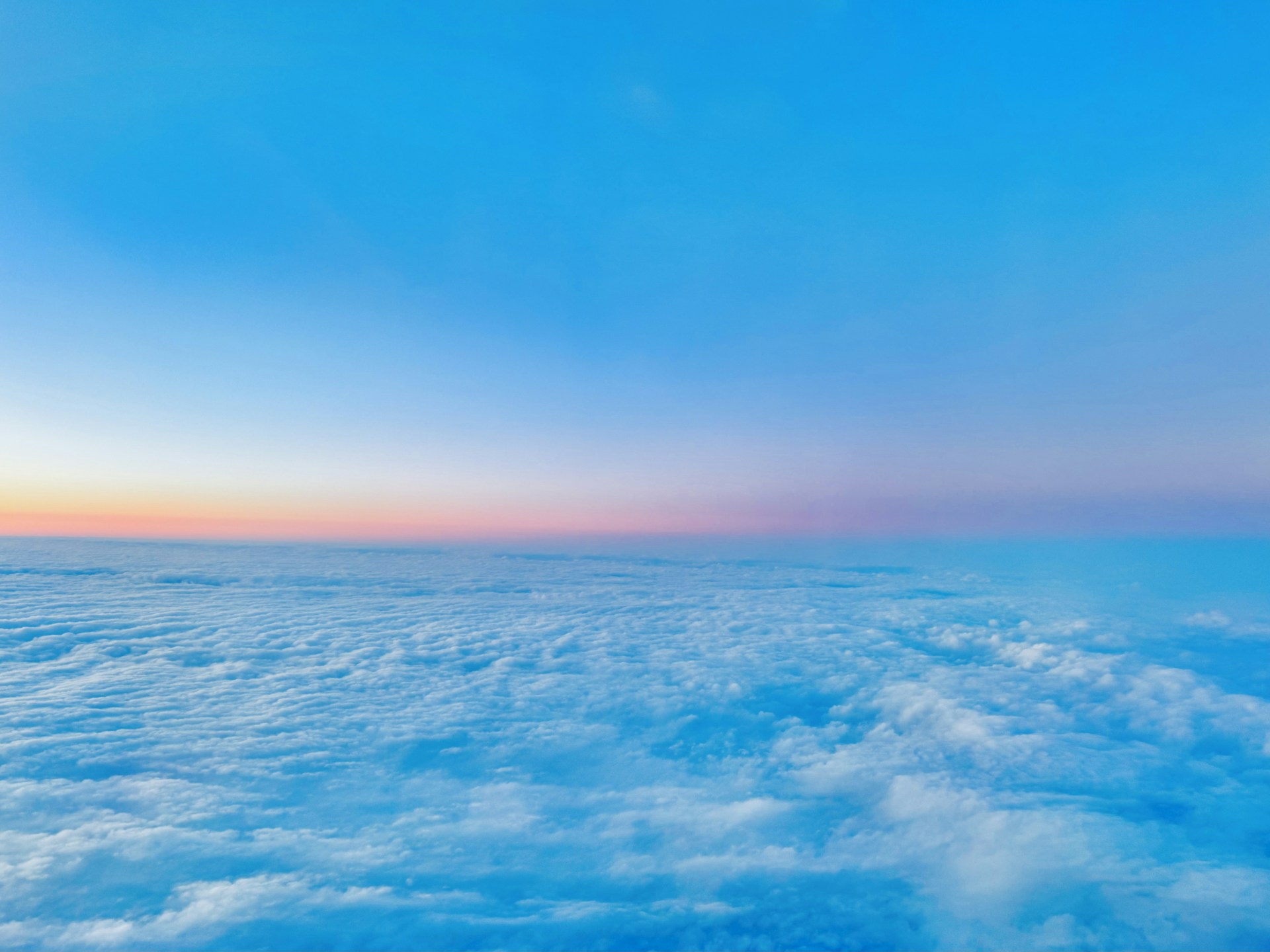 a view of the sky and clouds from an airplane