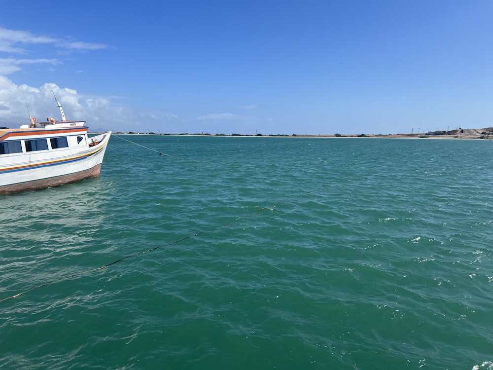 a boat floating on top of a large body of water