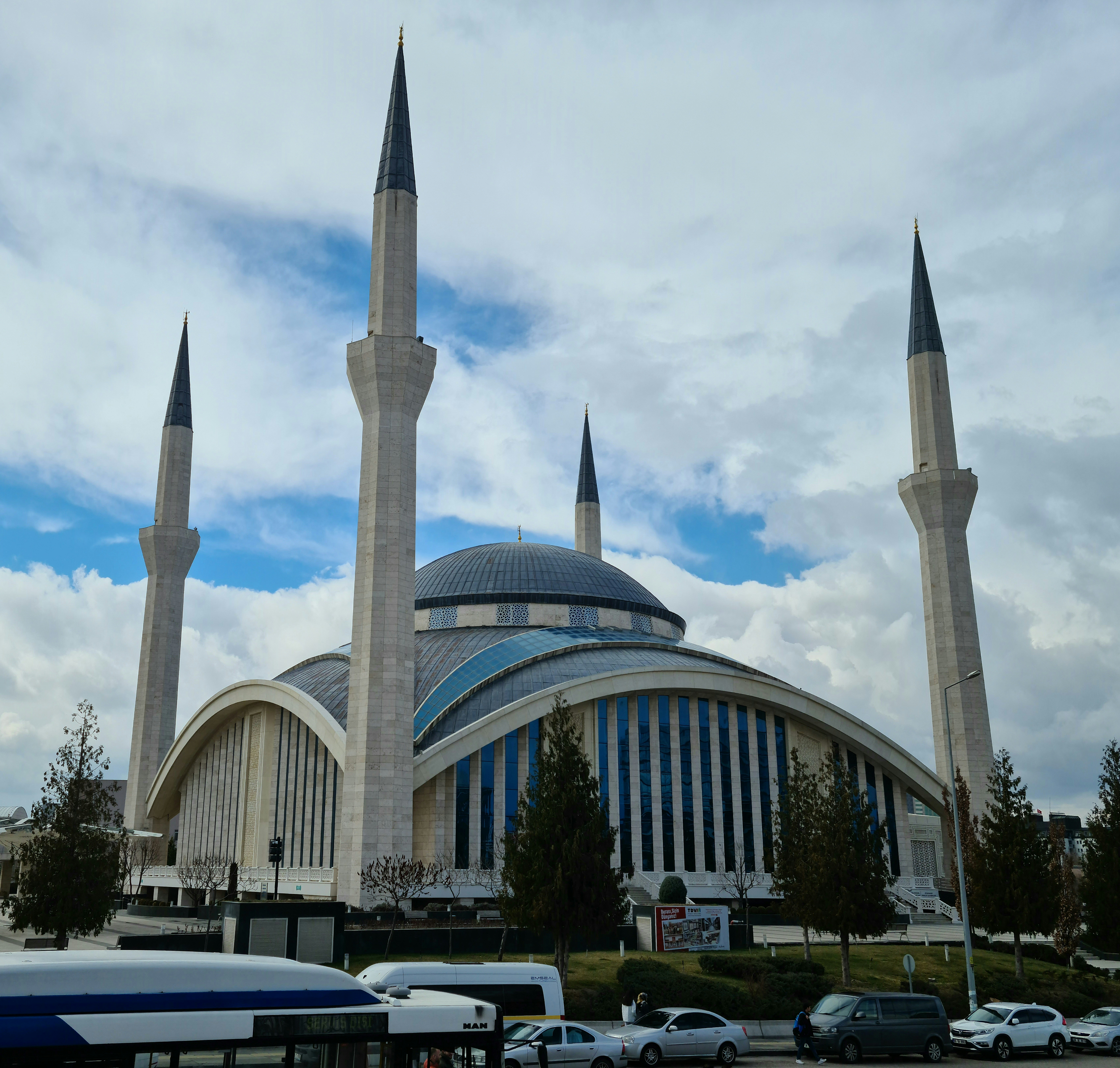 a large building with two towers and a sky background
