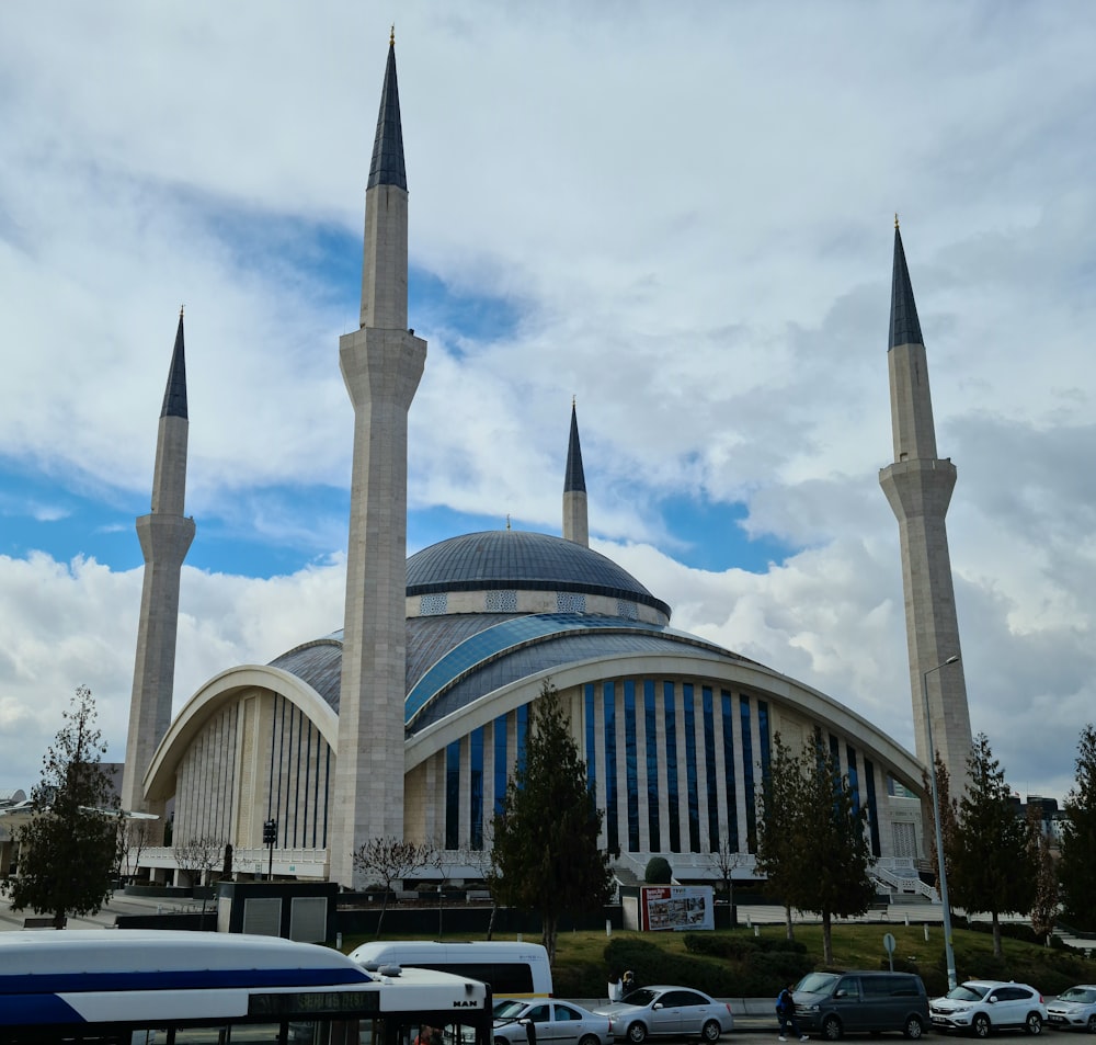 a large building with two towers and a sky background